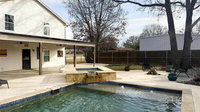 a view of a house with pool table and chairs