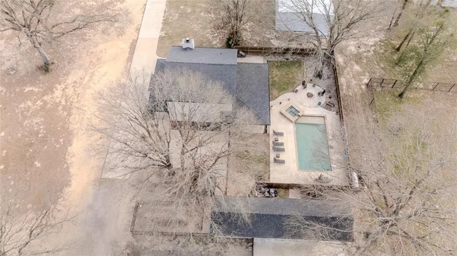 a aerial view of a house with a yard
