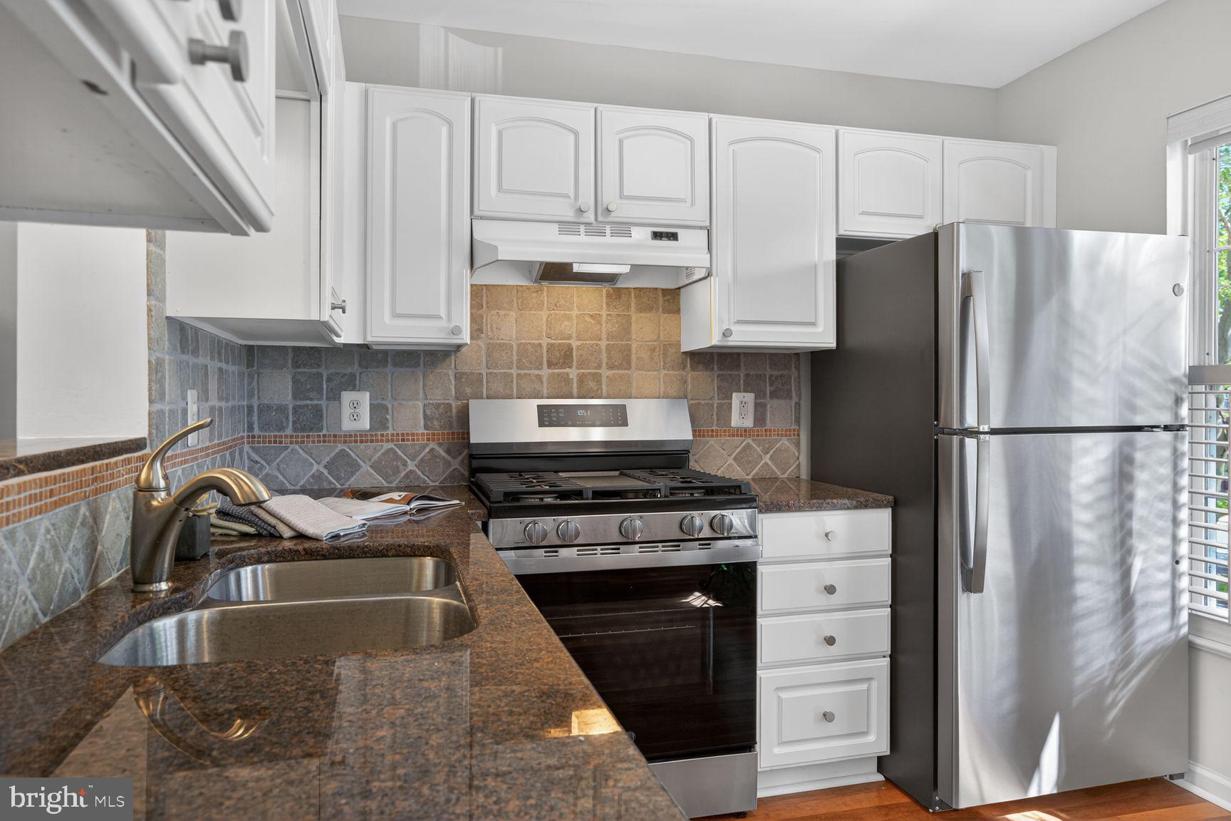 1343 Argall Place Alexandria, VA 22314 - Photo 25 of 35 Granite counters, ceramic stone tile backsplash