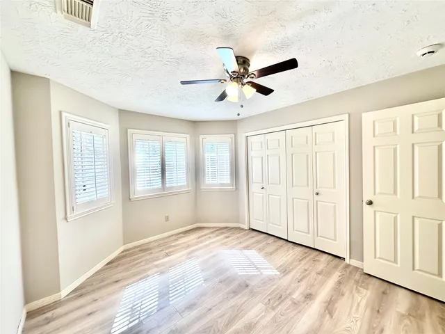 a kitchen with a refrigerator and a stove