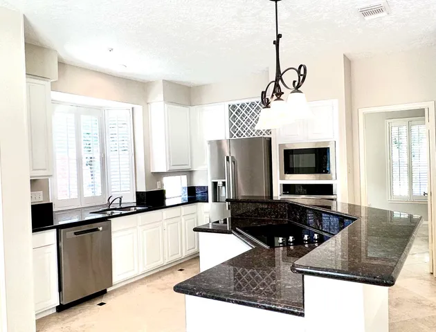 a view of a hallway with windows