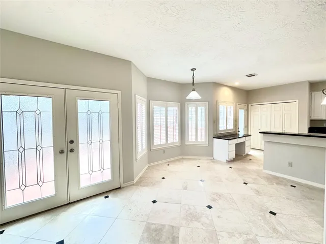 a view of a hallway view with wooden floor and staircase