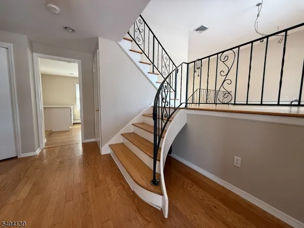 a view of entryway with wooden floor