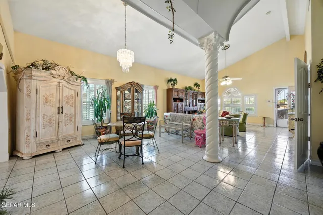 a bedroom with a bed and ceiling fan