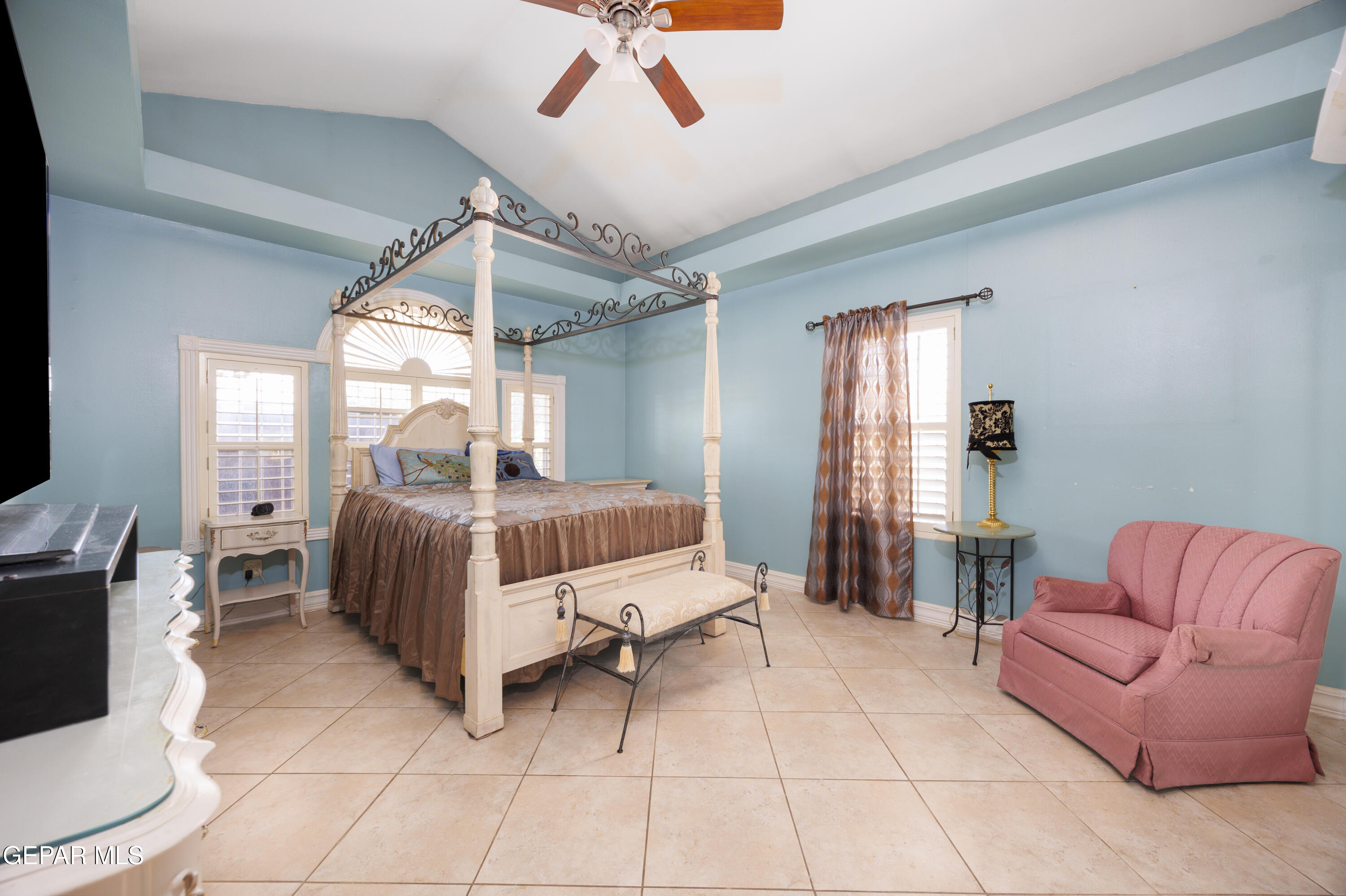 190 Polo Inn Road El Paso, TX 79915 - Photo 13 of 58 a bedroom with furniture and a couch