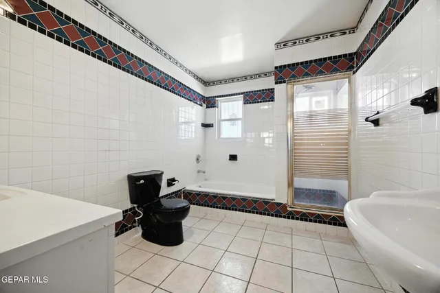 a bathroom with a bathtub and shower