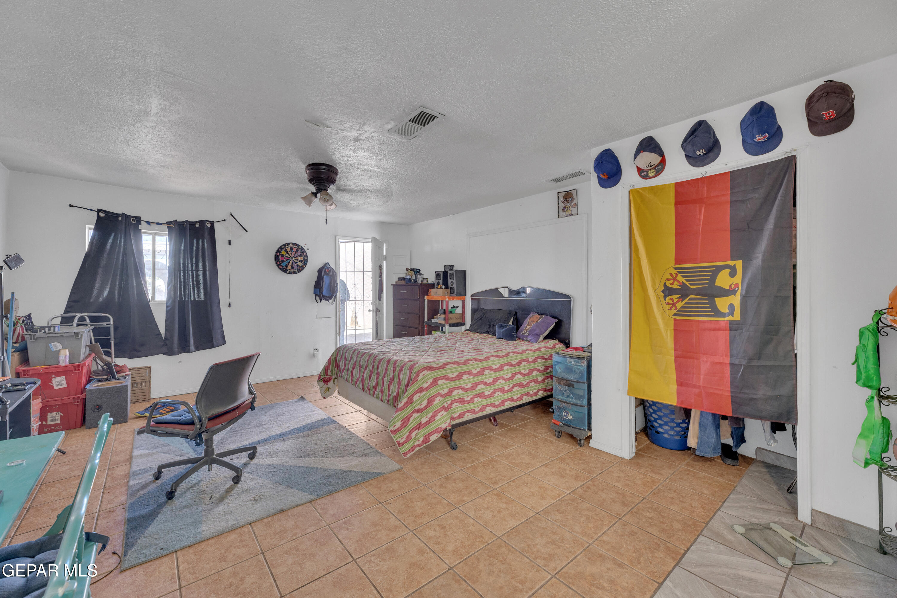 190 Polo Inn Road El Paso, TX 79915 - Photo 54 of 58 a bedroom with a bed and a window