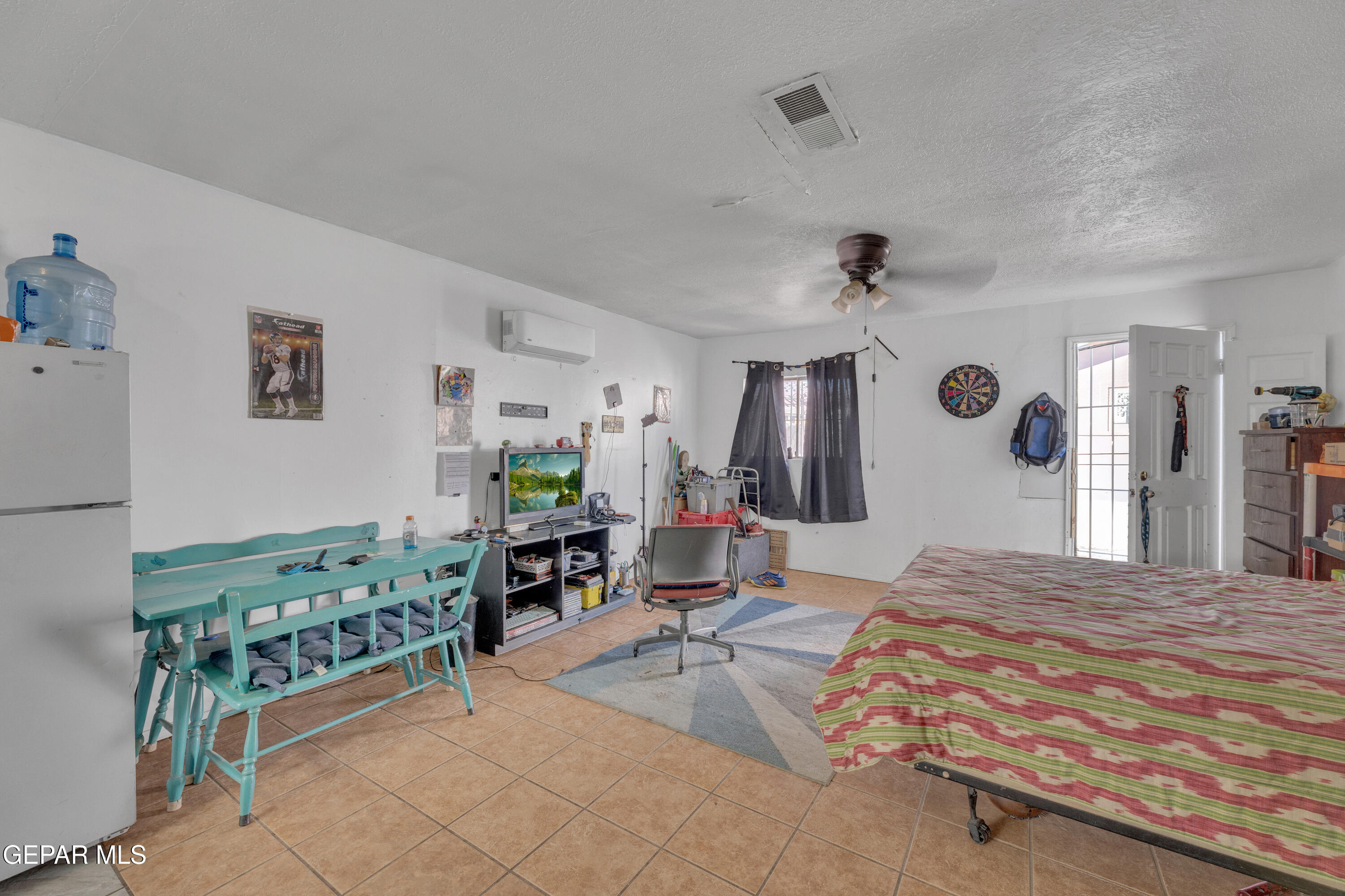 190 Polo Inn Road El Paso, TX 79915 - Photo 55 of 58 a bedroom with a bed mirror and a window