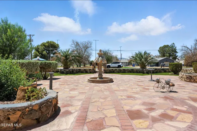 a view of a swimming pool with a lounge chair