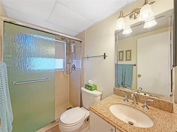 a front view of a multi story building with a yard