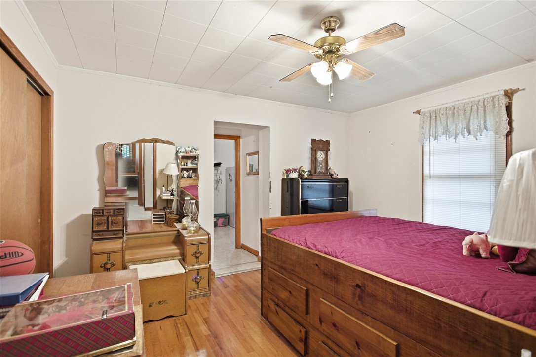 282 West Bennett Road Westminster, SC 29693 - Photo 21 of 42 This cozy bedroom offers hardwood floors and a ceiling fan, perfect for comfortable living.