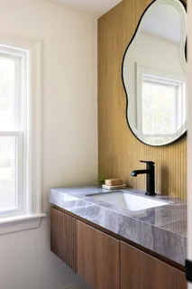 a bathroom with a sink and a mirror