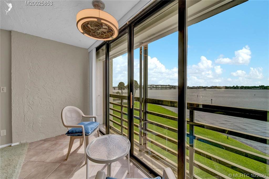 1950 Southwest Palm City Road, Unit 13305 Stuart, FL 34994 - Photo 14 of 28 a view of a chairs and table in a balcony
