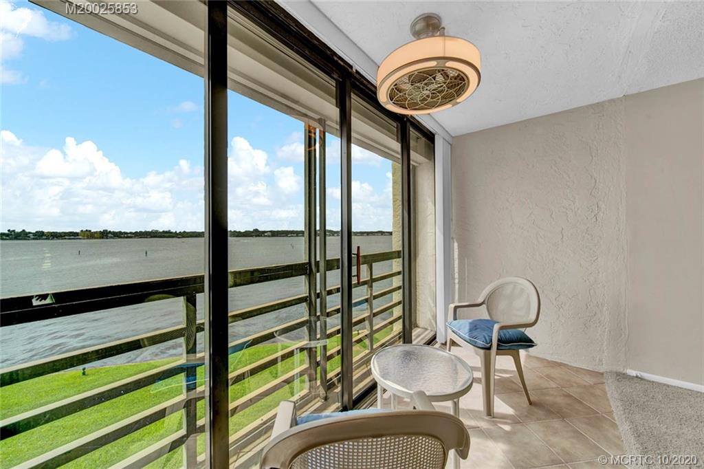1950 Southwest Palm City Road, Unit 13305 Stuart, FL 34994 - Photo 15 of 28 a view of a chairs and table in a balcony