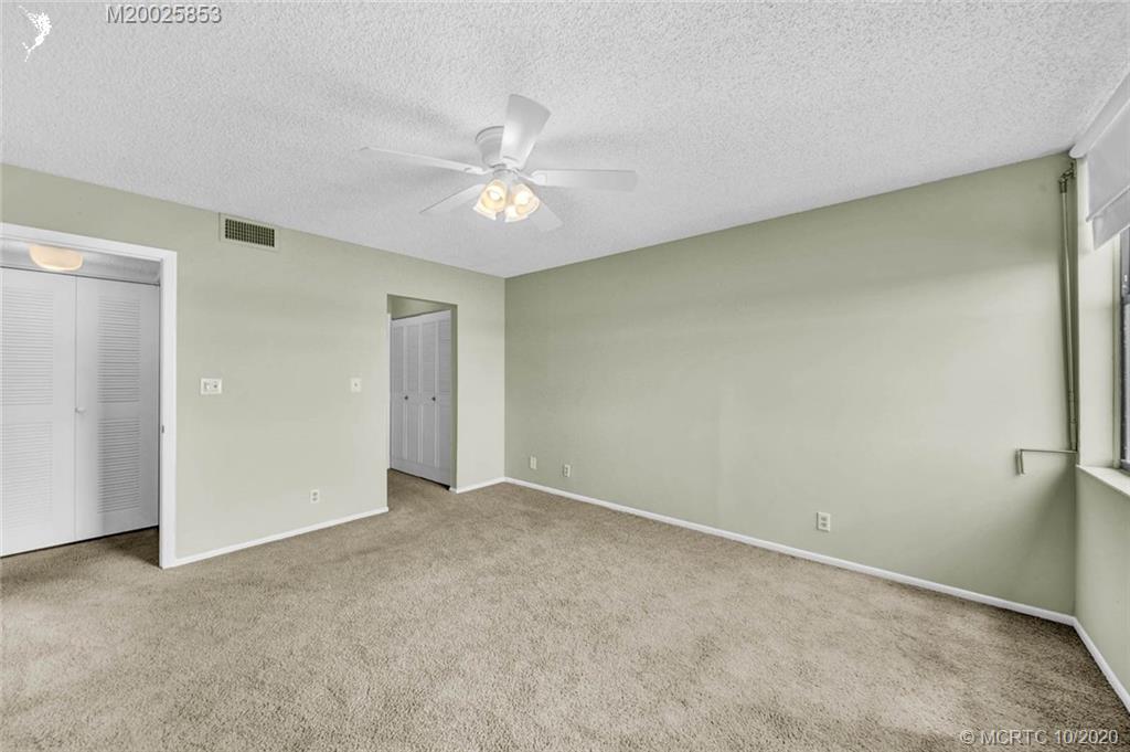 1950 Southwest Palm City Road, Unit 13305 Stuart, FL 34994 - Photo 19 of 28 a view of an empty room with a window