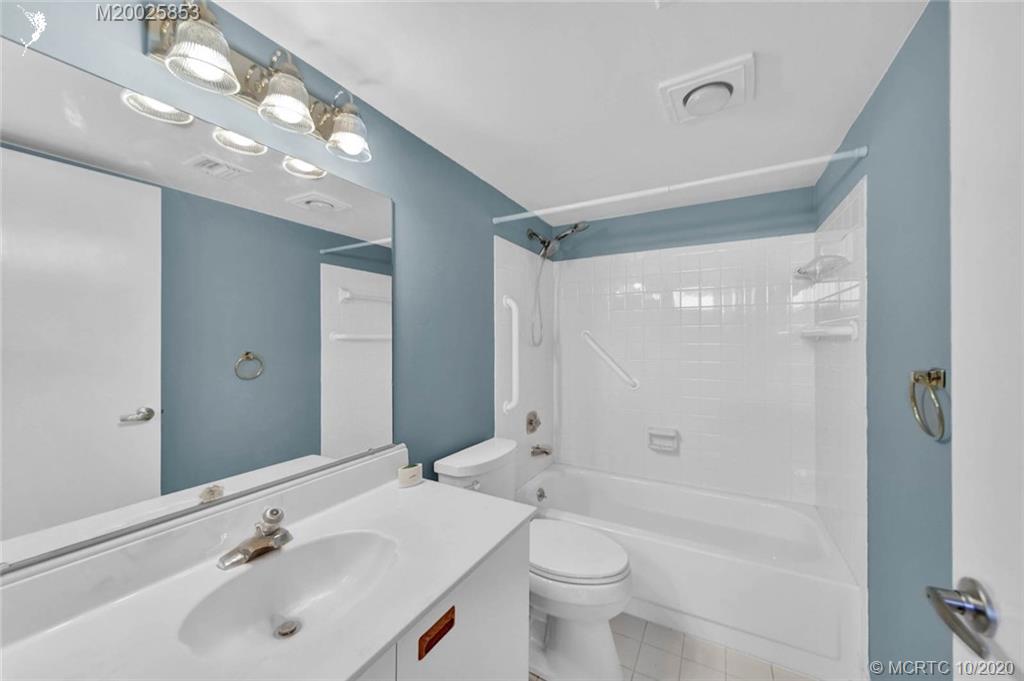 1950 Southwest Palm City Road, Unit 13305 Stuart, FL 34994 - Photo 24 of 28 a bathroom with a sink a toilet and shower
