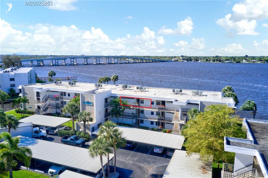 1950 Southwest Palm City Road, Unit 13305 Stuart, FL 34994 - Photo 3 of 28 a view of a chairs and table on the terrace