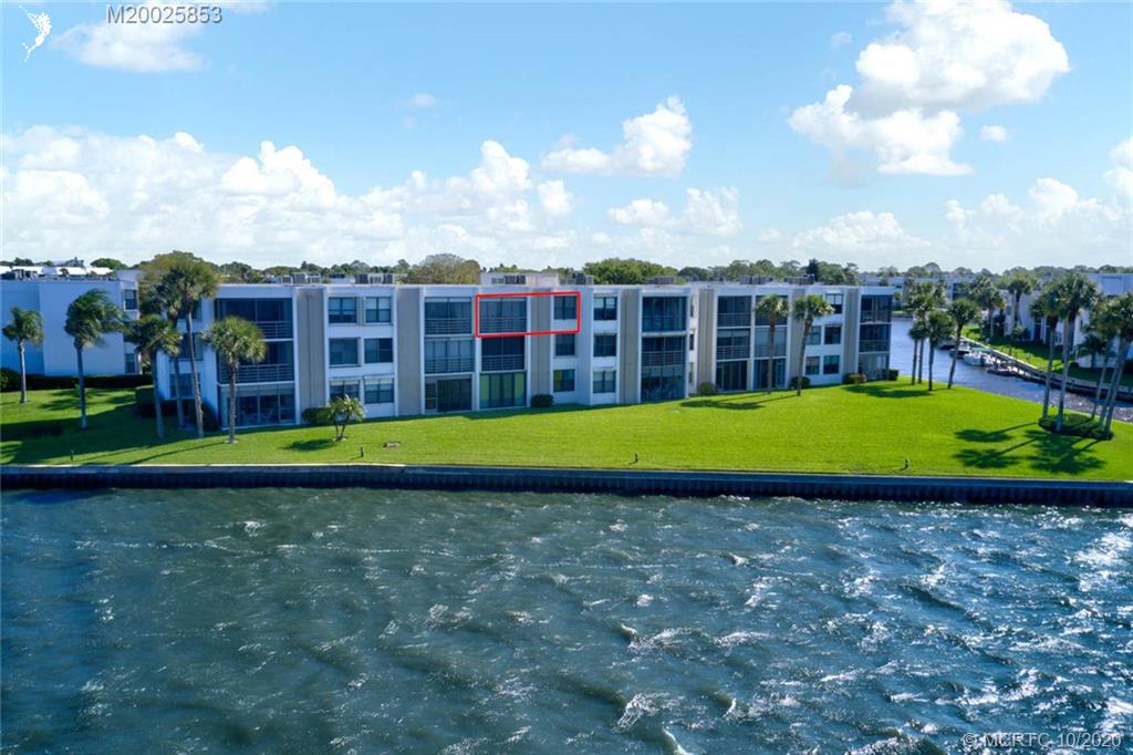 1950 Southwest Palm City Road, Unit 13305 Stuart, FL 34994 - Photo 4 of 28 a view of a house with swimming pool and yard