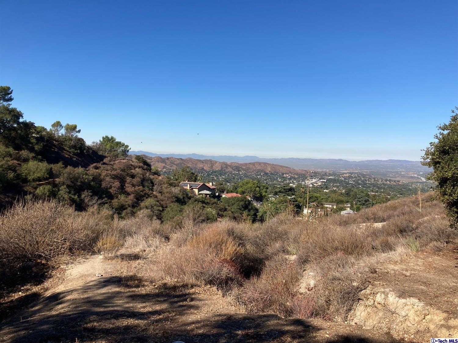 6835 Grenoble Street Tujunga, CA 91042 - Photo 3 of 13 a view of lake with mountain