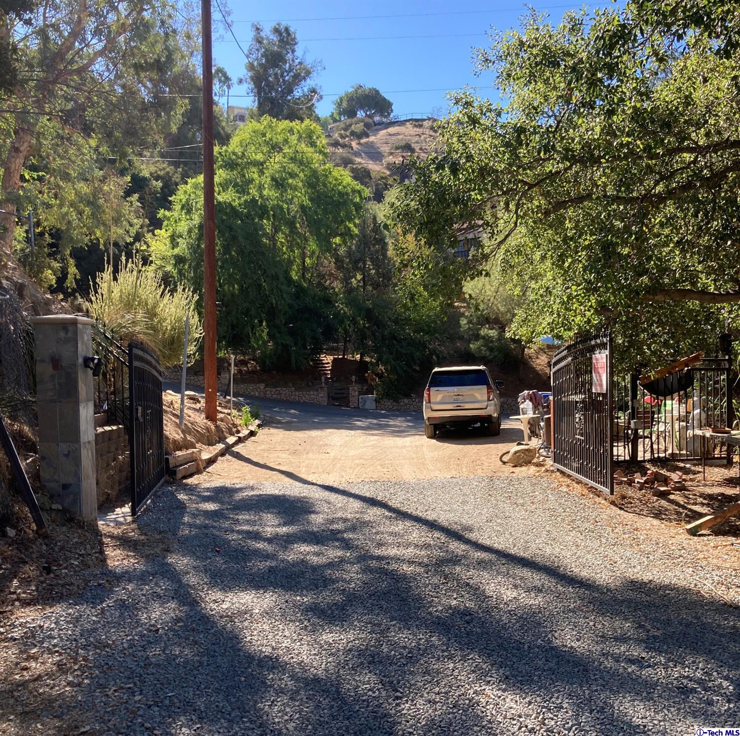 6835 Grenoble Street Tujunga, CA 91042 - Photo 10 of 13 a street view with large trees