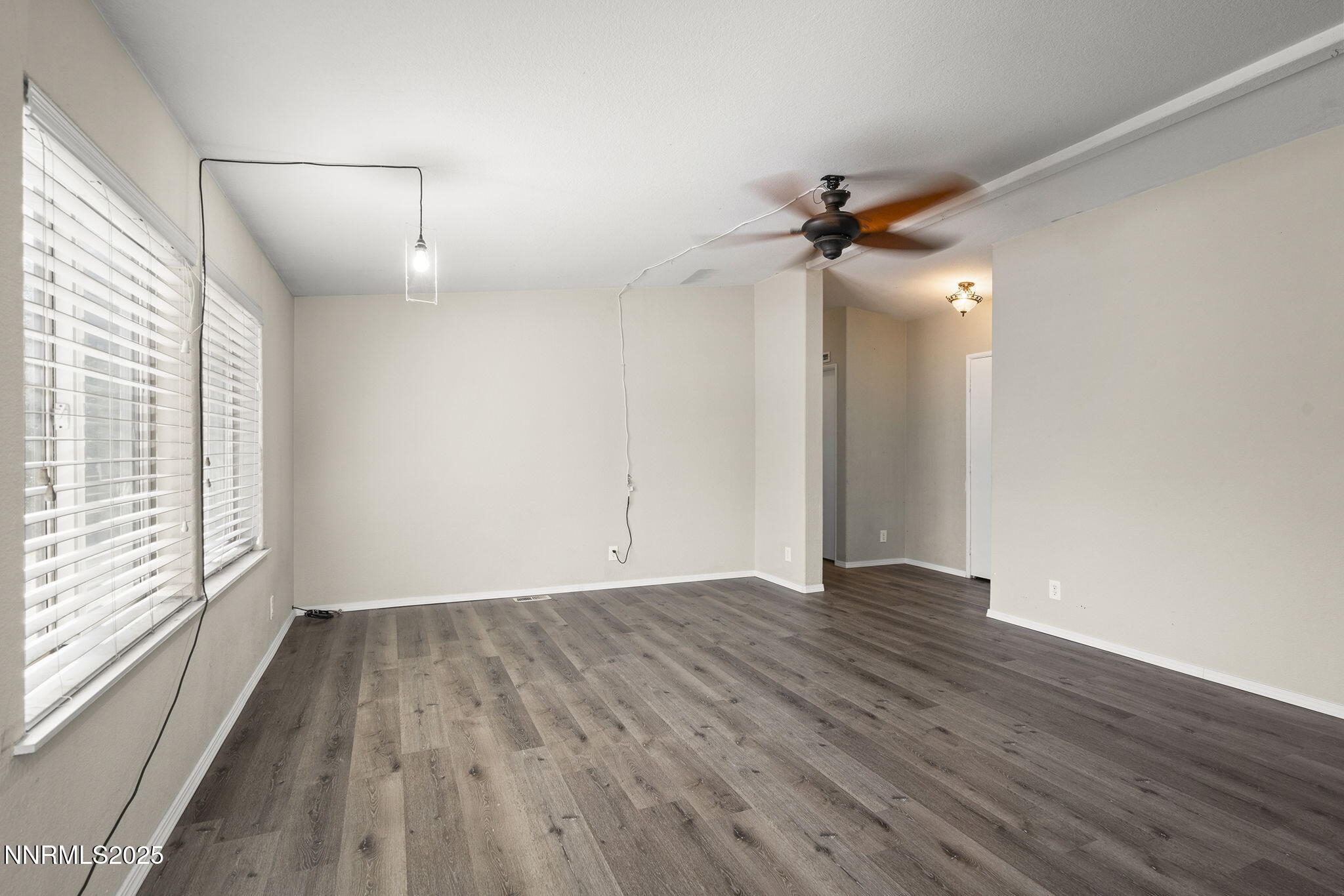 3665 Hummingbird Drive Reno, NV 89508 - Photo 6 of 21 wooden floor in an empty room with a window