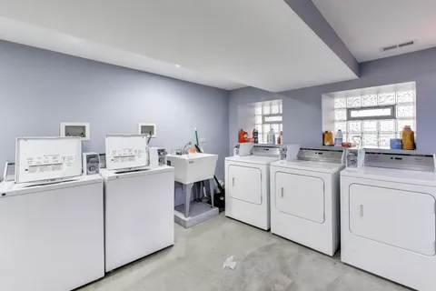 a kitchen that has a sink and a stove in it