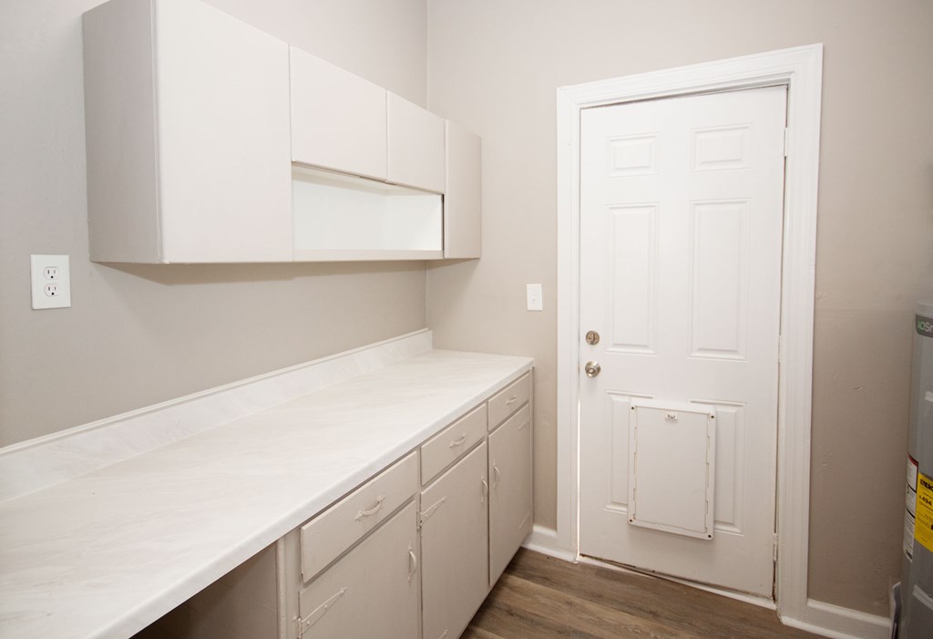 108 27th Street Columbus, GA 31904 - Photo 14 of 26 a utility room with wooden floor washer and dryer