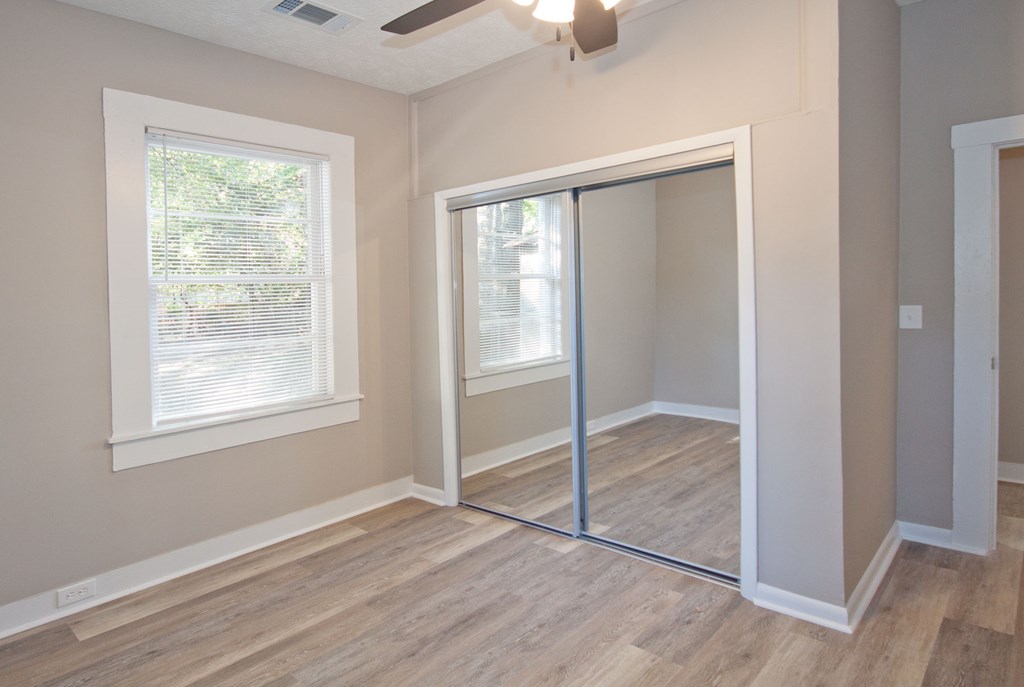 108 27th Street Columbus, GA 31904 - Photo 15 of 26 a view of an empty room with window and wooden floor