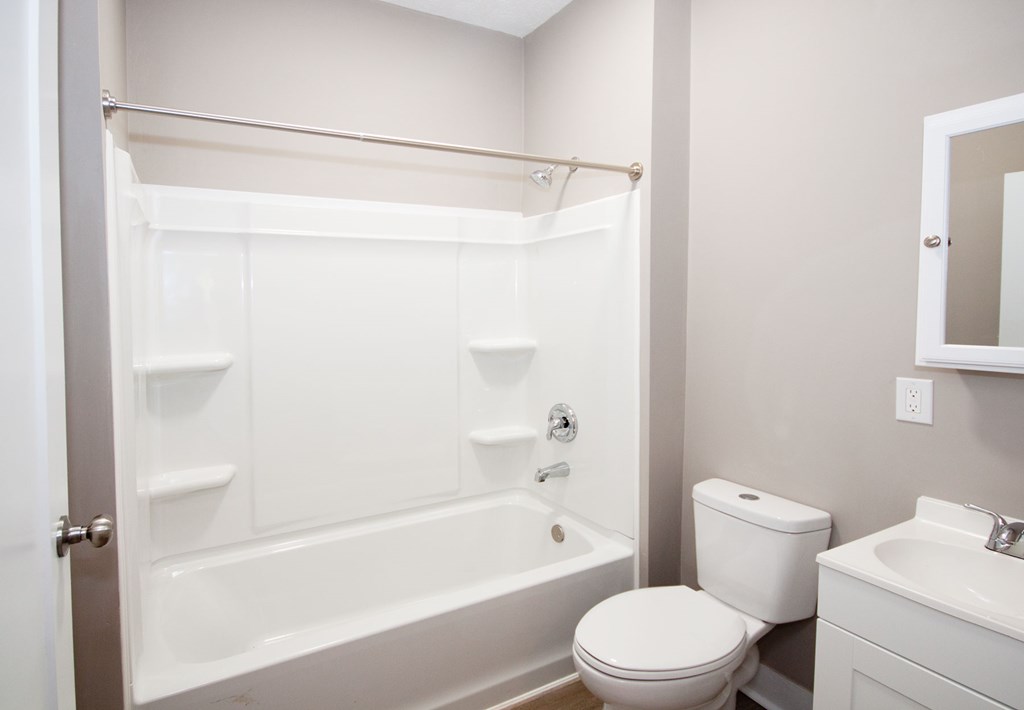 108 27th Street Columbus, GA 31904 - Photo 17 of 26 a bathroom with a bathtub a toilet and a shower