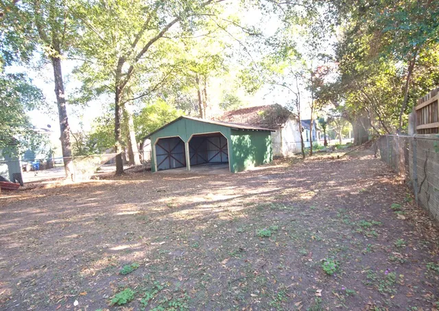 a house view with a backyard space