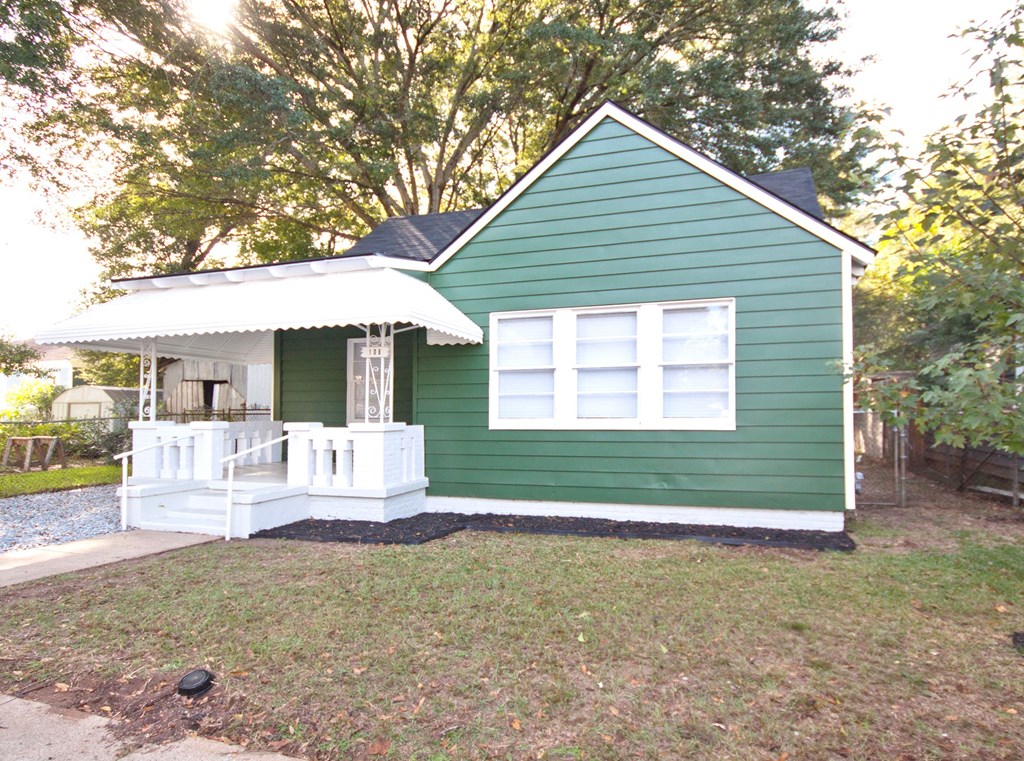 108 27th Street Columbus, GA 31904 - Photo 2 of 26 a front view of a house with outdoor seating