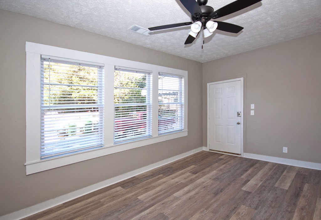 108 27th Street Columbus, GA 31904 - Photo 7 of 26 a view of an empty room with a window and a chandelier fan