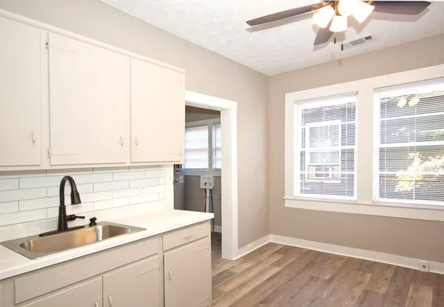 a kitchen with a sink and a window