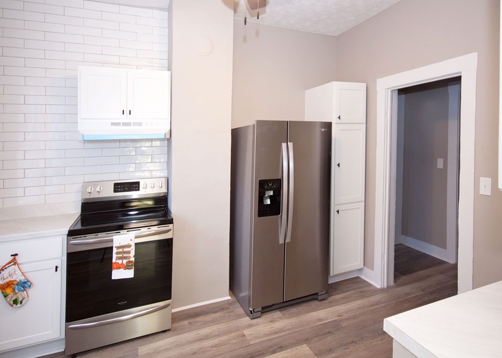 108 27th Street Columbus, GA 31904 - Photo 10 of 26 a kitchen with stainless steel appliances a refrigerator stove and sink