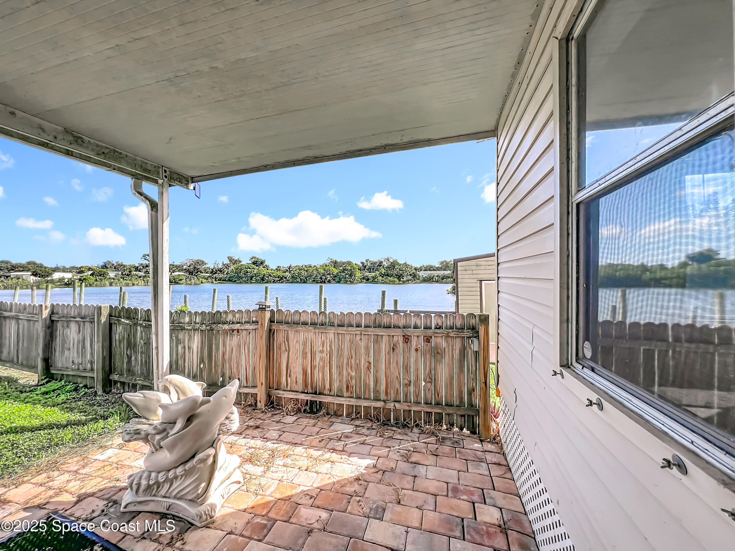 425 Baker Road Merritt Island, FL 32953 - Photo 21 of 27 a view of a chair and tables in the patio