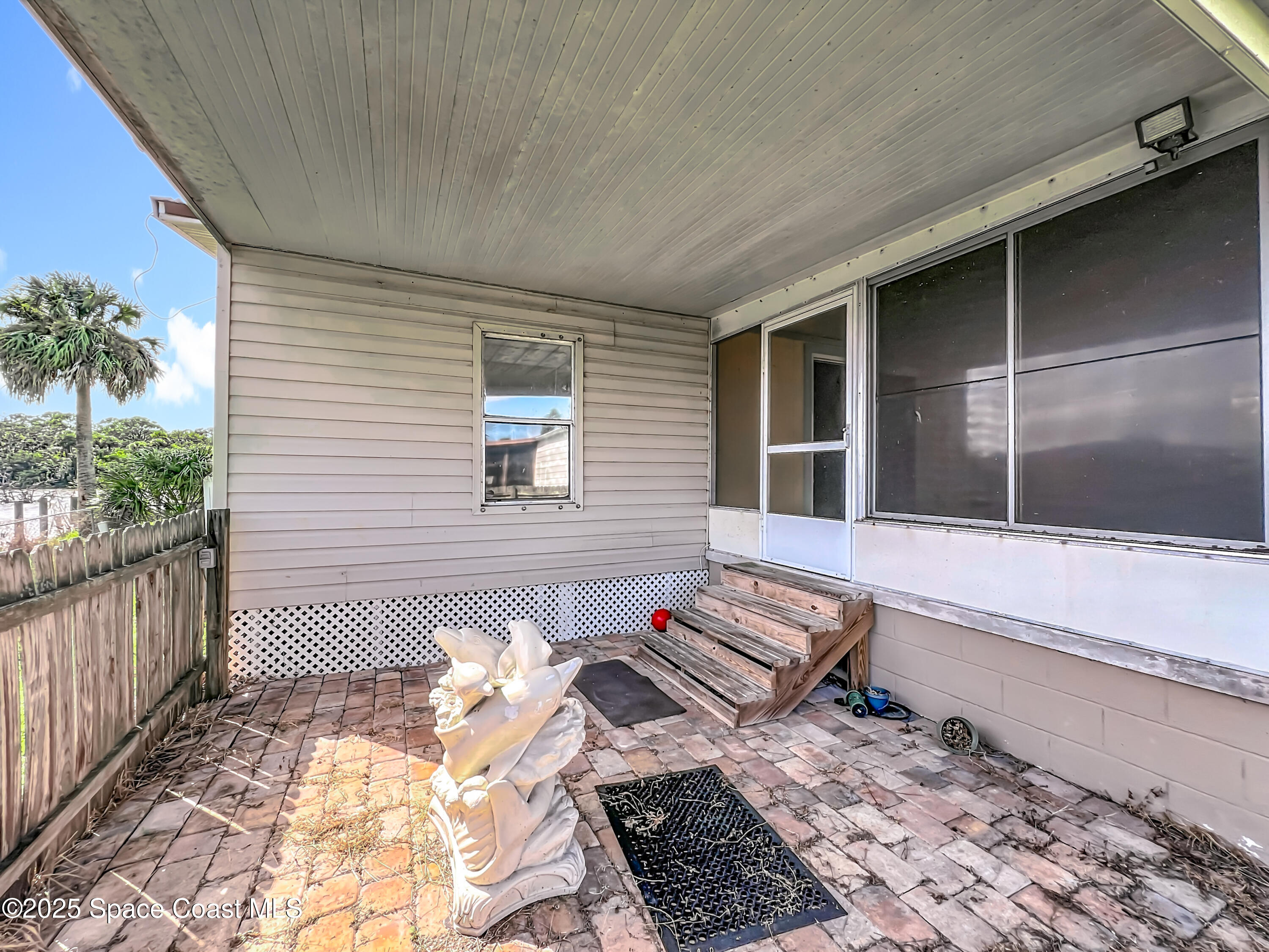 425 Baker Road Merritt Island, FL 32953 - Photo 22 of 27 a view of a back yard from a balcony