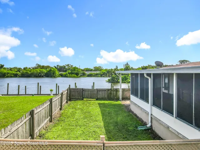 a view of a lake with a yard