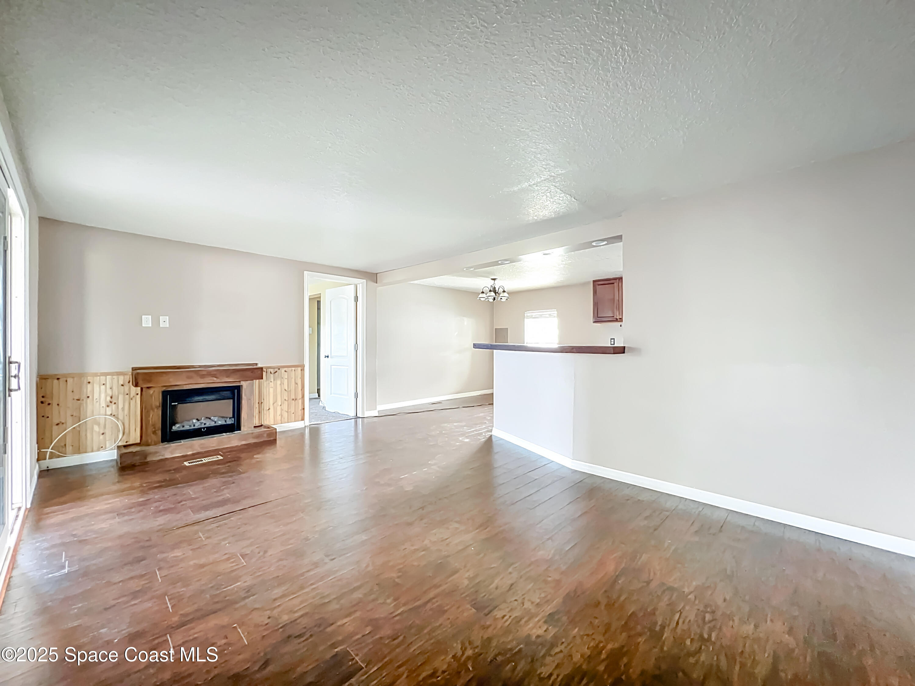 425 Baker Road Merritt Island, FL 32953 - Photo 5 of 27 a view of a livingroom with a fireplace