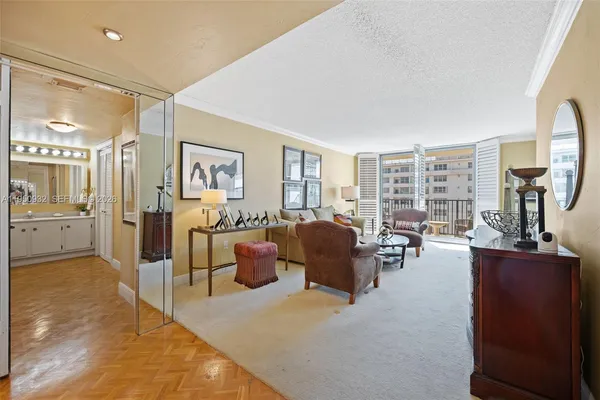 a living room with furniture and a large window