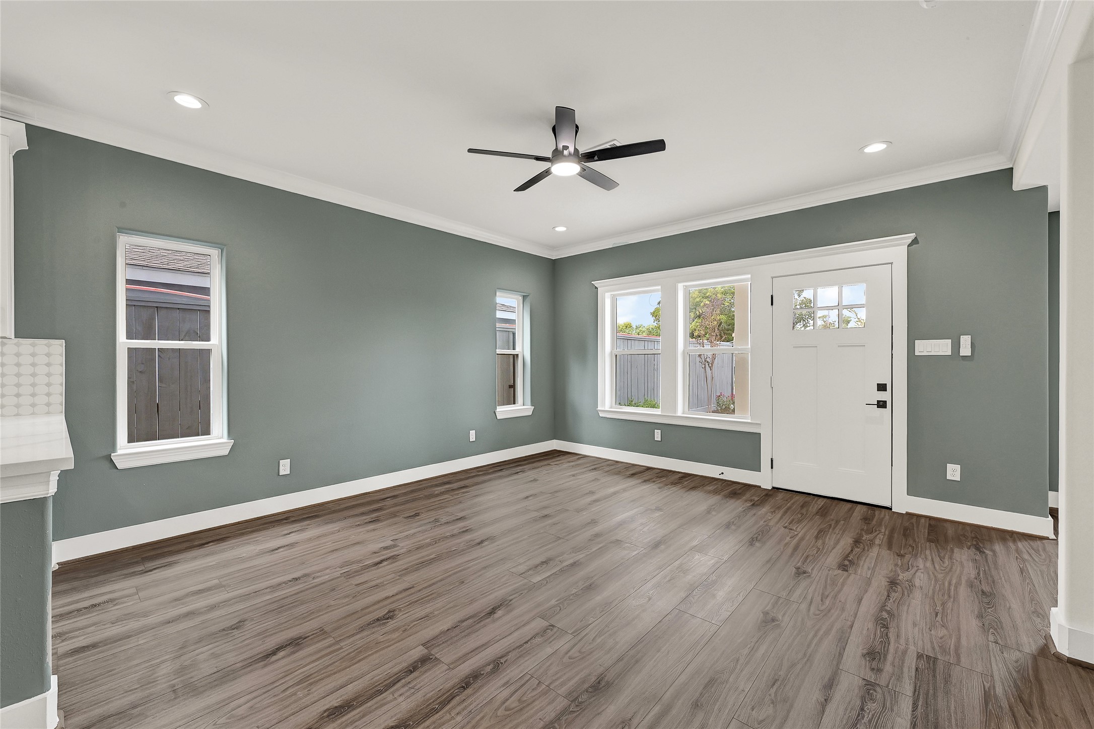 3834 Mt Pleasant Street Houston, TX 77021 - Photo 36 of 50 a view of an empty room with wooden floor and a window