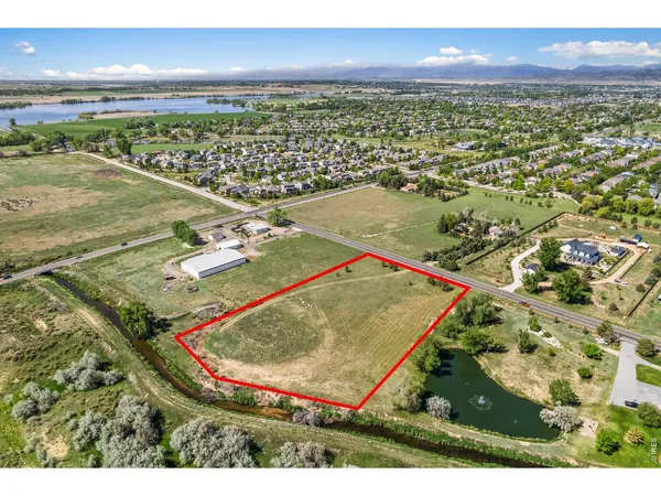 an aerial view of a pool an ocean view