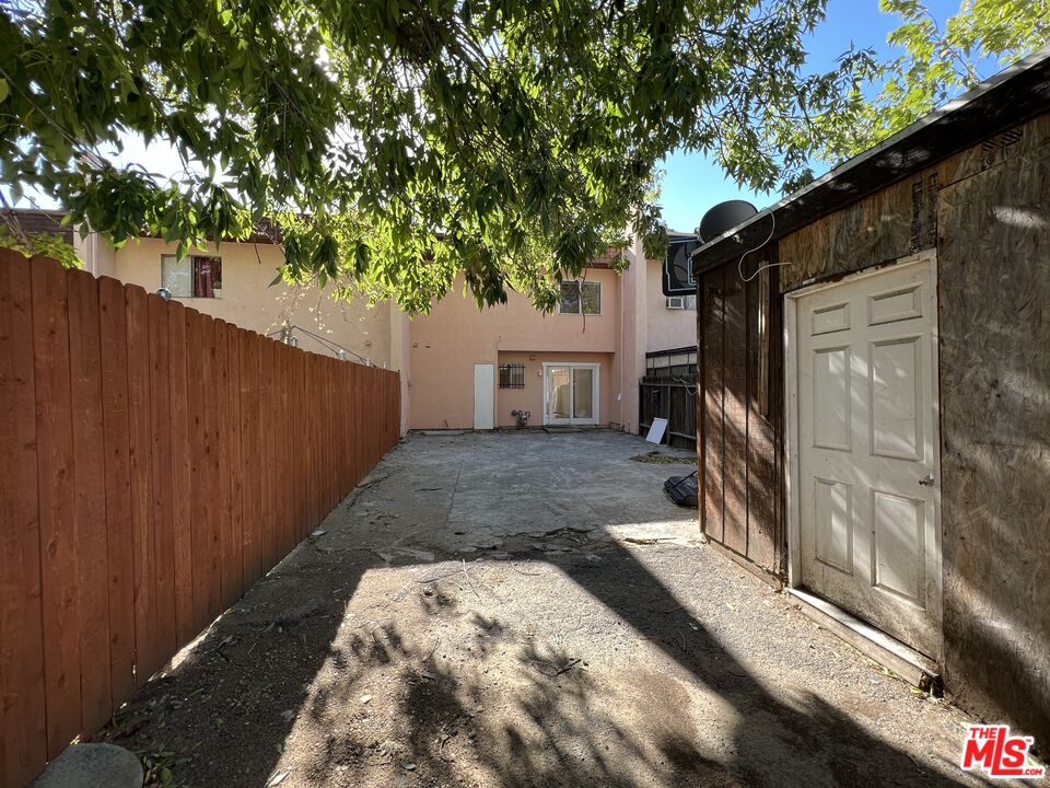 418 West Jackson Street Rialto, CA 92376 - Photo 9 of 24 a view of a backyard with a tree