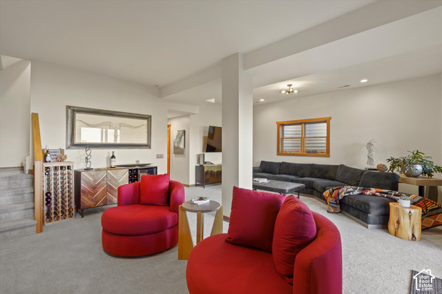 5878 Snowbasin Road Huntsville, UT 84317 - Photo 40 of 90 Carpeted living space featuring recessed lighting, a built-in wine rack, and a wood-framed window with horizontal blinds