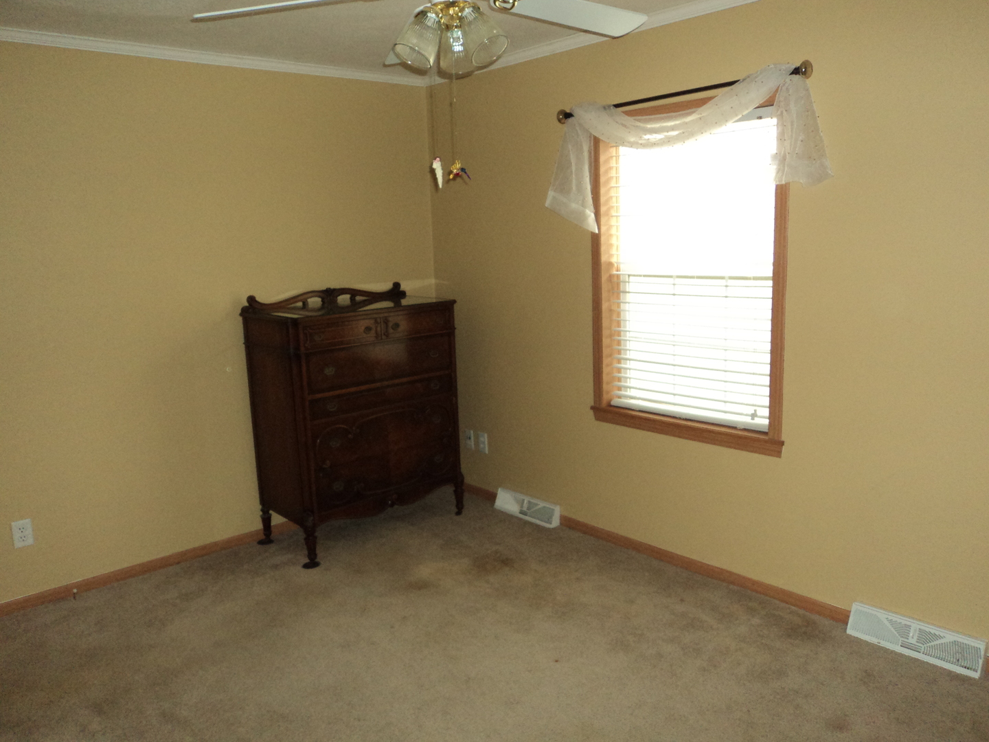 22912 Pinehurst Drive Frankfort, IL 60423 - Photo 15 of 21 a room that has a dresser and a window