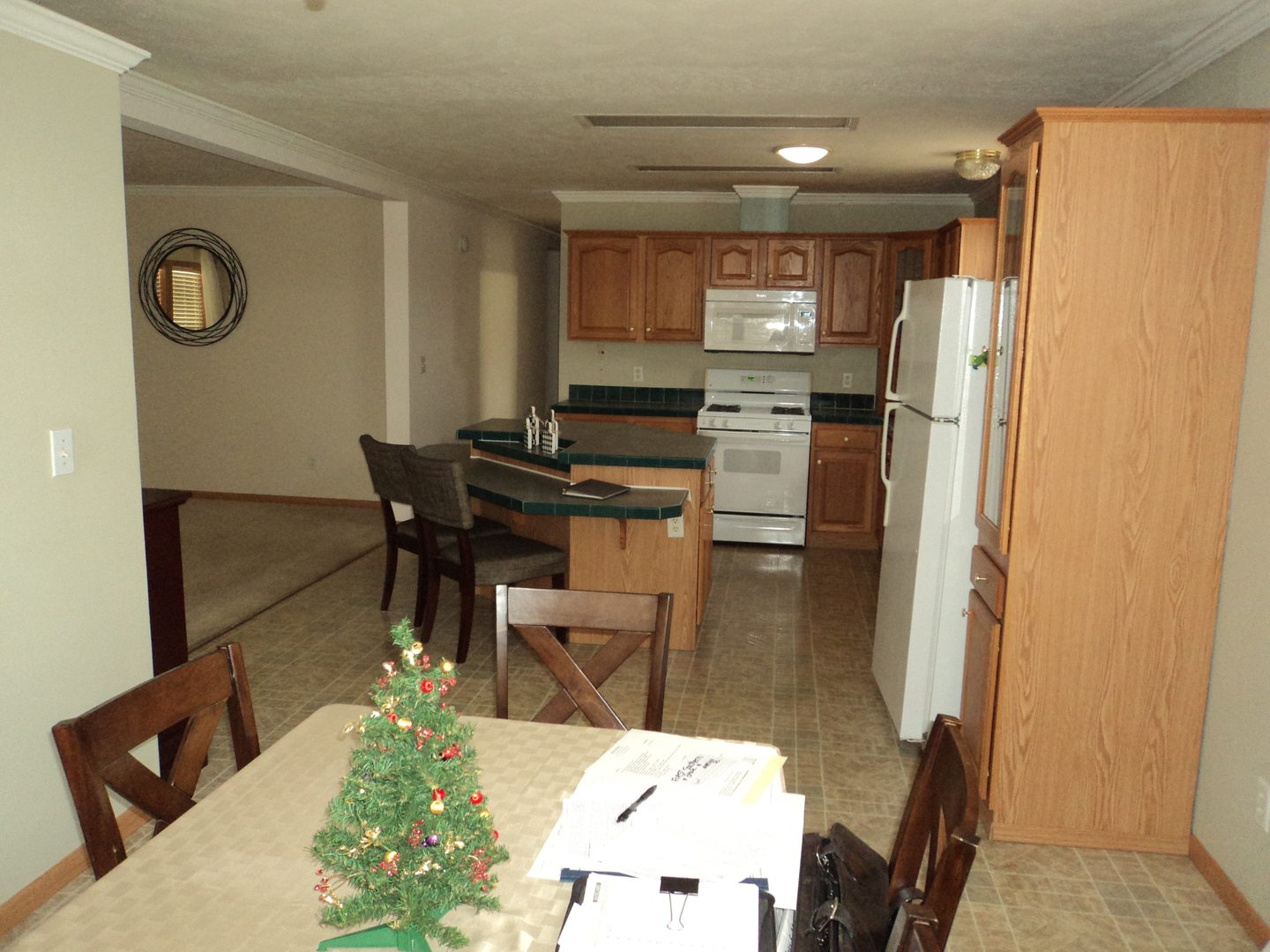 22912 Pinehurst Drive Frankfort, IL 60423 - Photo 8 of 21 a kitchen with stainless steel appliances kitchen island granite countertop a refrigerator and a dining table