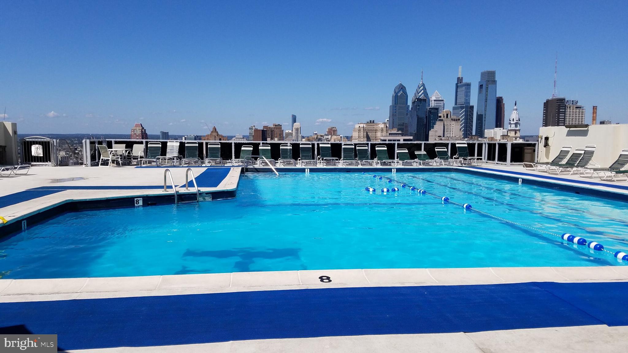 604 South Washington Square, Unit 418 Philadelphia, PA 19106 - Photo 14 of 22 a view of a swimming pool with outdoor seating and yard
