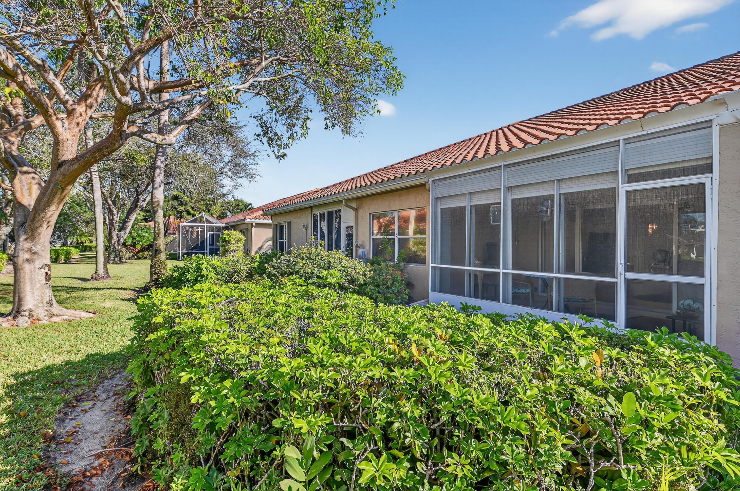 6140 Long Key Lane Boynton Beach, FL 33472 - Photo 14 of 24 front view of a house with a yard