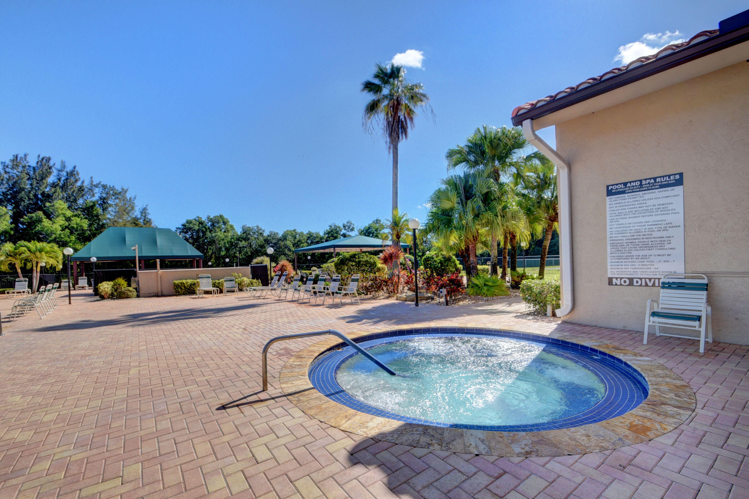 6140 Long Key Lane Boynton Beach, FL 33472 - Photo 22 of 24 a view of a swimming pool with a patio