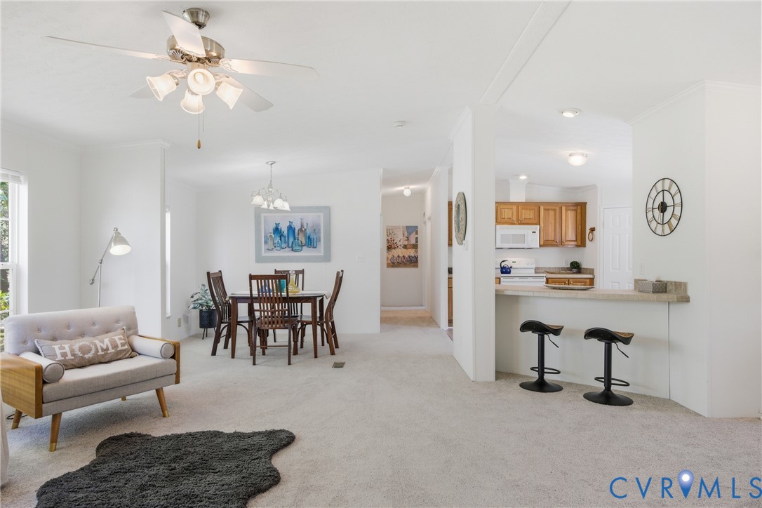 42 Rabbit Run Saluda, VA 23149 - Photo 5 of 46 Living and dining areas with light-toned carpeting