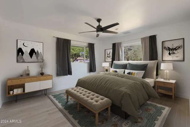 a bedroom with a bed and a couch